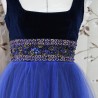 Detail of shirred tulle skirt in midnight blue evening gown