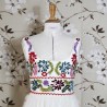 White sleeveless wedding dress on mannequin, front view