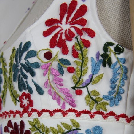 One-of-a-kind midi wedding dress on mannequin with floral details