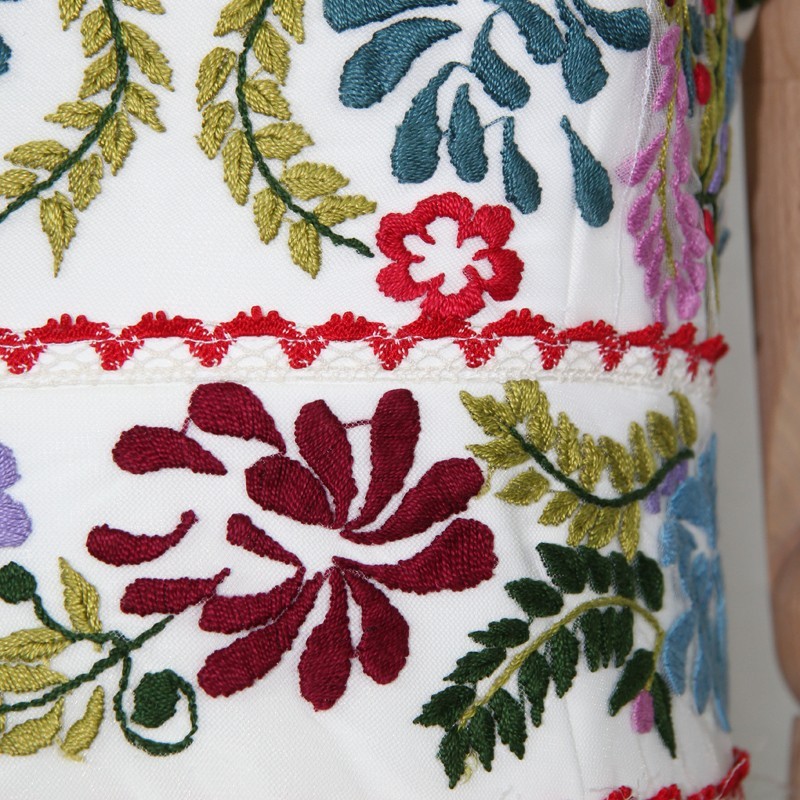 Detailed embroidery on bodice of one-of-a-kind wedding dress