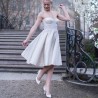 Side profile of below-knee alternative wedding dress with swing silhouette