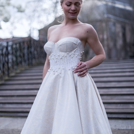 Front view of strapless below-knee princess wedding dress, hand-embellished, made in France.