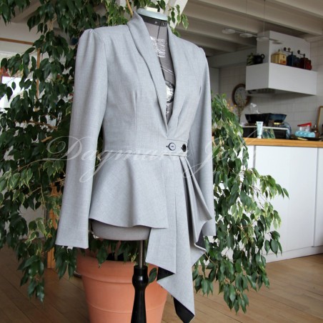 Custom-made asymmetrical long peplum blazer with a shawl collar, featuring an elegant and structured silhouette.