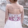 Back view of modest bridal midi dress with invisible zipper and flowing tulle layers and hand embroidery