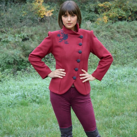 Custom red wool jacket, asymmetrical front, suitable as outer coat or office-ready wear.