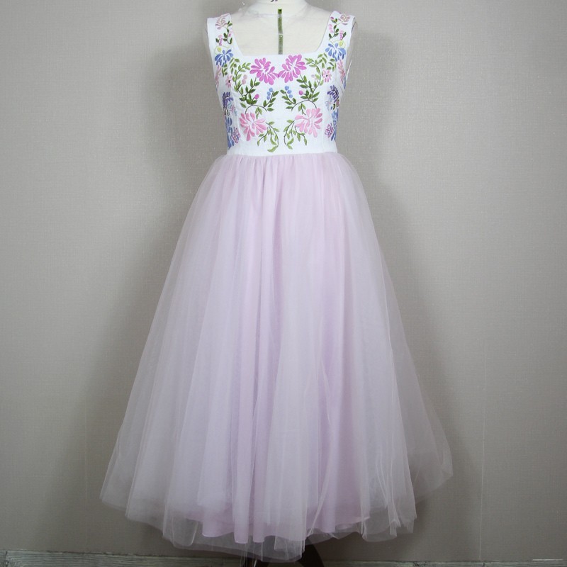 Full-length view of midi dress on mannequin, showing soft silhouette