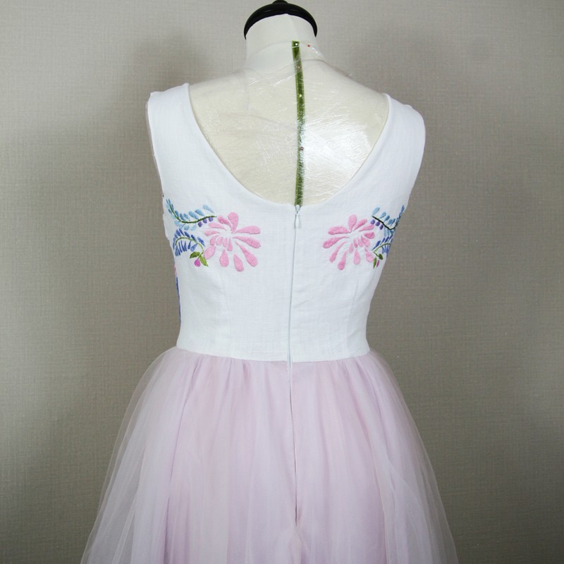 Back view of linen-lined tulle midi dress with flowing silhouette