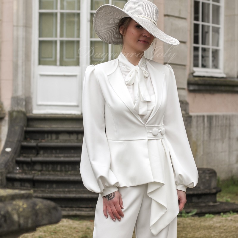 White fluid crepe jacket with offset silhouette, flared waist, and puffed sleeves, bespoke piece