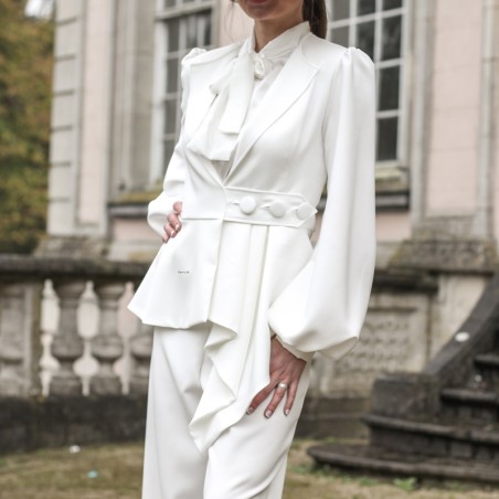 White tailored piece with deconstructed hem, sculpted silhouette and puff sleeves, custom-made