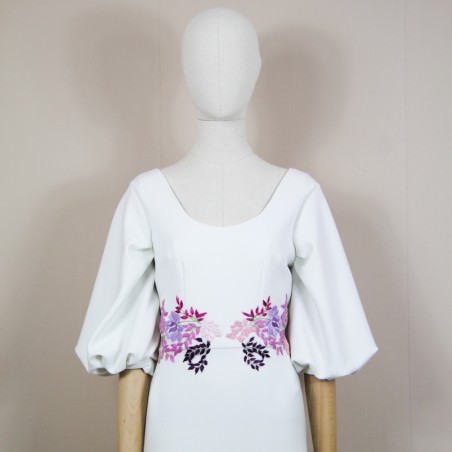 Close-up of hand embroidery details on the dress bodice