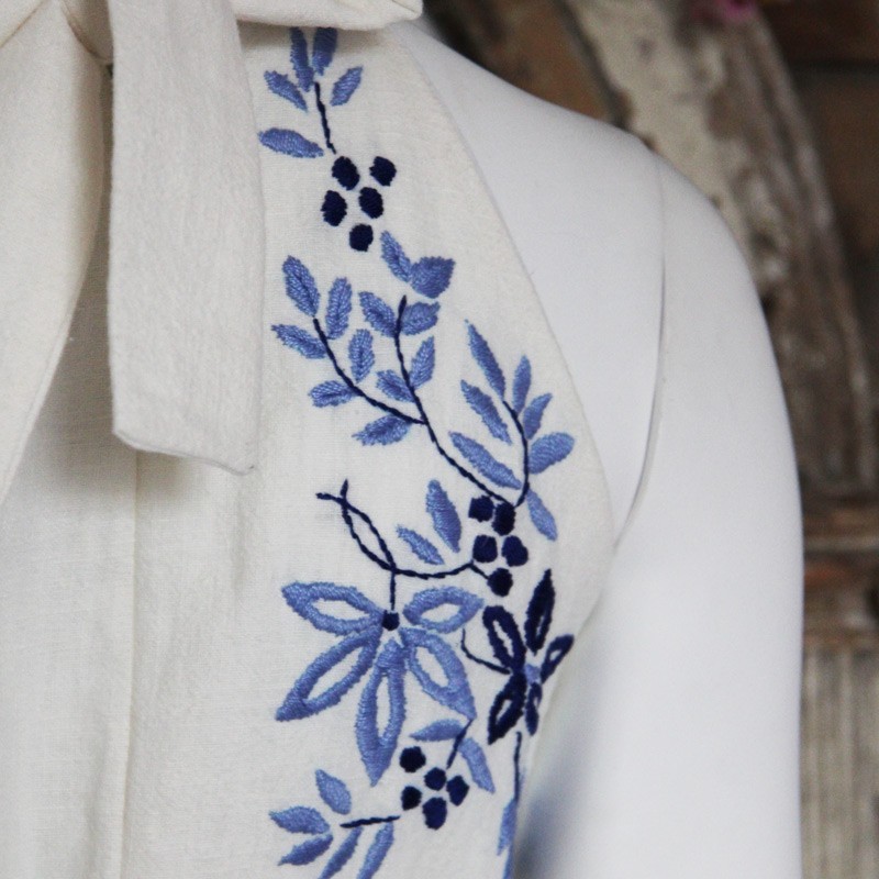 Detailed view of halter neckline with hand-sewn details