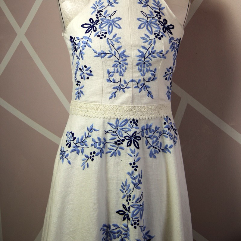 Embroidered floral motif on handmade ivory dress