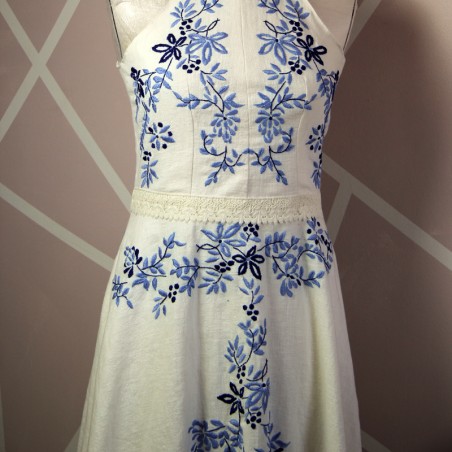 Embroidered floral motif on handmade ivory dress