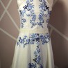 Embroidered floral motif on handmade ivory dress