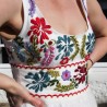 Close-up of hand embroidered floral detail on French wedding dress