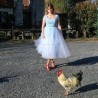 White tulle dress flowing in natural light outdoors