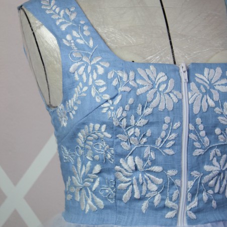 Close-up of hand-embroidered floral pattern on lin