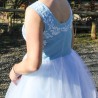 Detail of hand embroidery on white tulle fabric