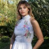 Bride wearing halter white linen midi wedding dress outdoors