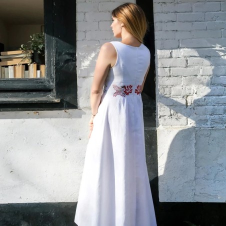 Back view of floor-length linen bridal gown with hand-embroidered details and made in France