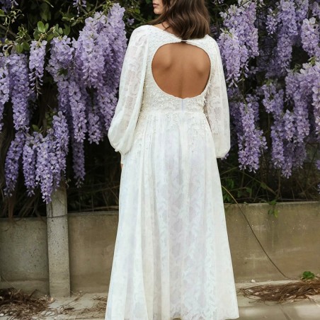 Zoomed-in detail of the open back design with lace and pearl hand embellishments.