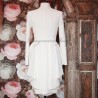 Asymmetrical ivory blazer with pleated peplum, collar officier, long sleeves, golden boutons, made in France