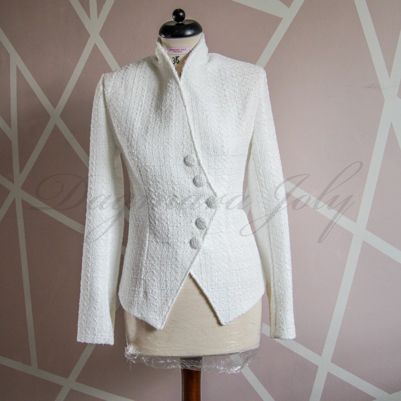 Front view of women's white bridal asymmetrical tweed jacket with tailored fit.