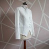 Side view of women's white bridal asymmetrical tweed jacket highlighting sleek silhouette.