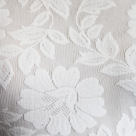 Zoomed-in view of fine French lace fabric used in custom wedding dress.
