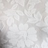 Zoomed-in view of fine French lace fabric used in custom wedding dress.