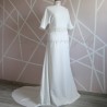 Front view of a floor-length wedding dress with dolman sleeves