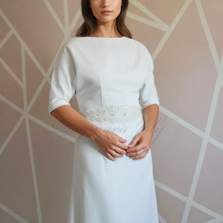 Front view of a floor-length wedding dress with dolman sleeves