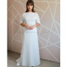 Front view of a floor-length wedding dress with dolman sleeves