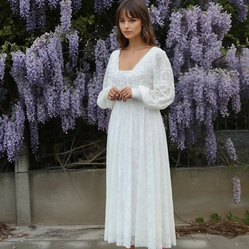 Front view of lace wedding midi dress with balloon sleeves, with hand-embellished lace and pearl details.