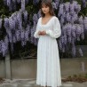 Front view of lace wedding midi dress with balloon sleeves, with hand-embellished lace and pearl details.