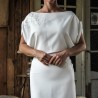 Detail of lace applique on sheath wedding dress bodice