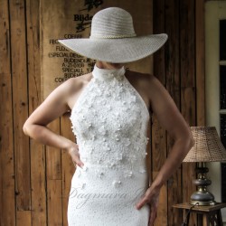 Bride wearing a modest halter neck sheath wedding dress with train, made of delicate cotton lace.