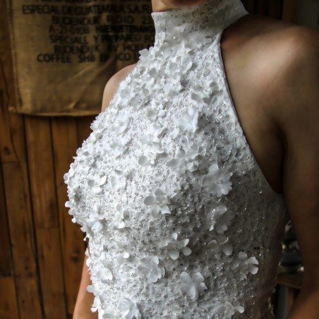 Halter neckline with intricate lace and embellishments on a minimalist bridal gown.
