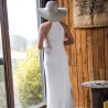 Back view of a halter neck wedding dress with elegant train and subtle lace detailing.