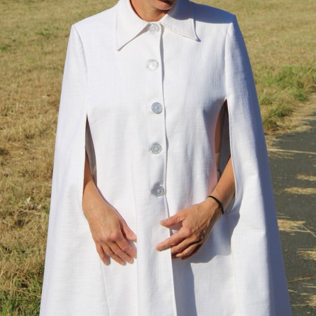 Flowing bridal cape caught in movement, highlighting its airy swing silhouette and oversized fit