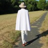 Back view of an oversized A-line bridal cape with flowing fabric and a clean, minimalist design