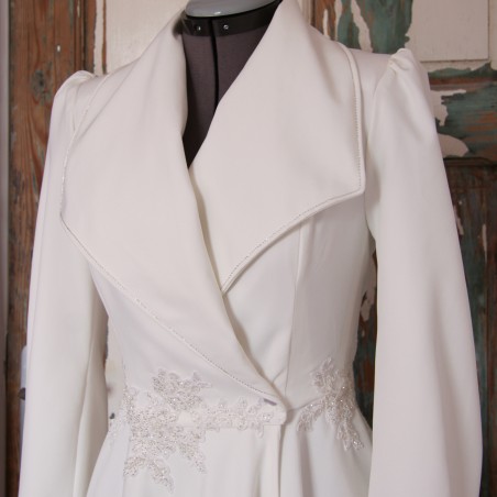 Elegant bridal gown with shawl collar and wrap-style silhouette