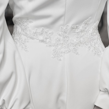 Close-up of hand-embellished detailing on French wedding dress