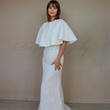 Handmade bridal cape draped over a wedding gown