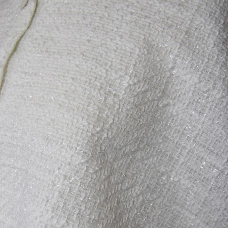 Close-up of tweed fabric texture on bridal cape