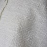 Close-up of tweed fabric texture on bridal cape