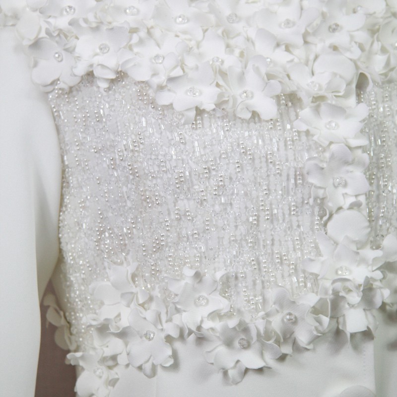 Detail of crystals, pearls, and sequins on bodice.