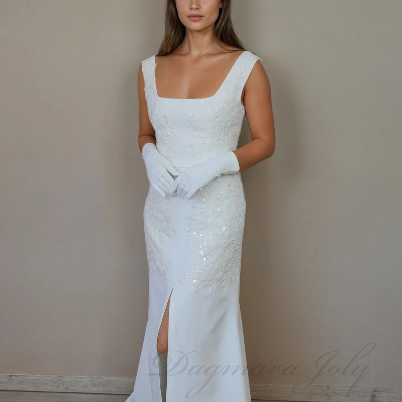 Full view of bridal gown with short back train, front slit and square neckline