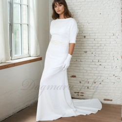 Front view of a floor-length wedding gown with dolman sleeves and a dramatic cathedral train extending gracefully behind