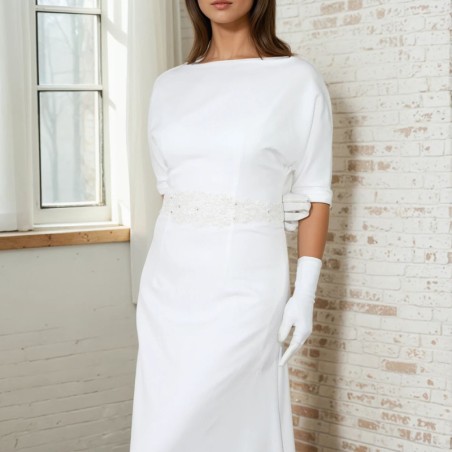 Front view of a floor-length wedding dress with dolman sleeves